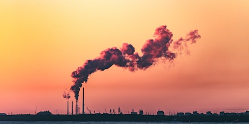 Body of water under polluted sky Body of water under polluted sky