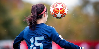 A woman playing football