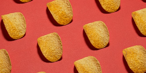 Pringles displayed neatly against a red background Pringles displayed neatly against a red background