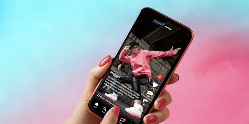 TikTok interface on mobile phone showing shared video content TikTok interface on mobile phone showing shared video content